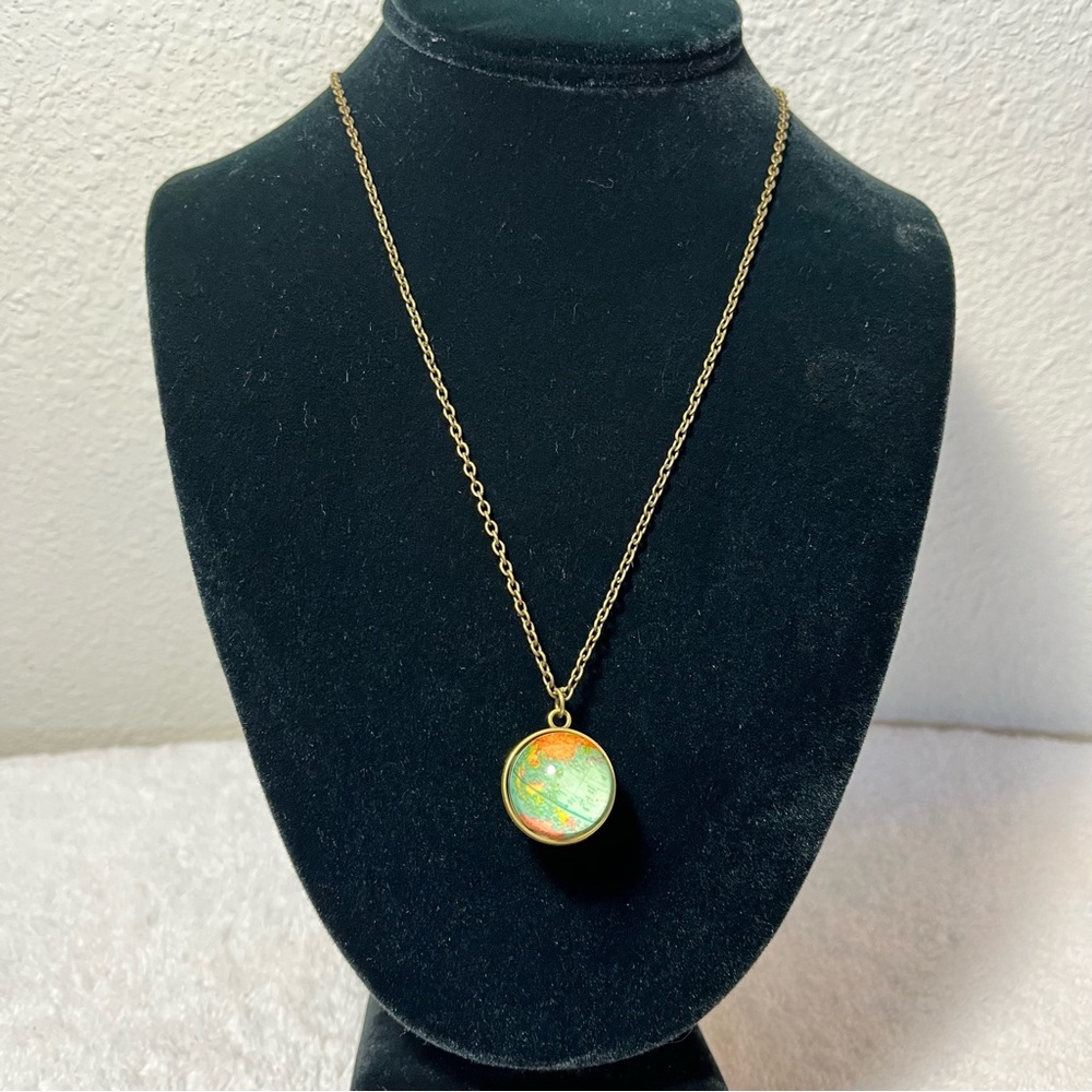 World map pendant necklace.